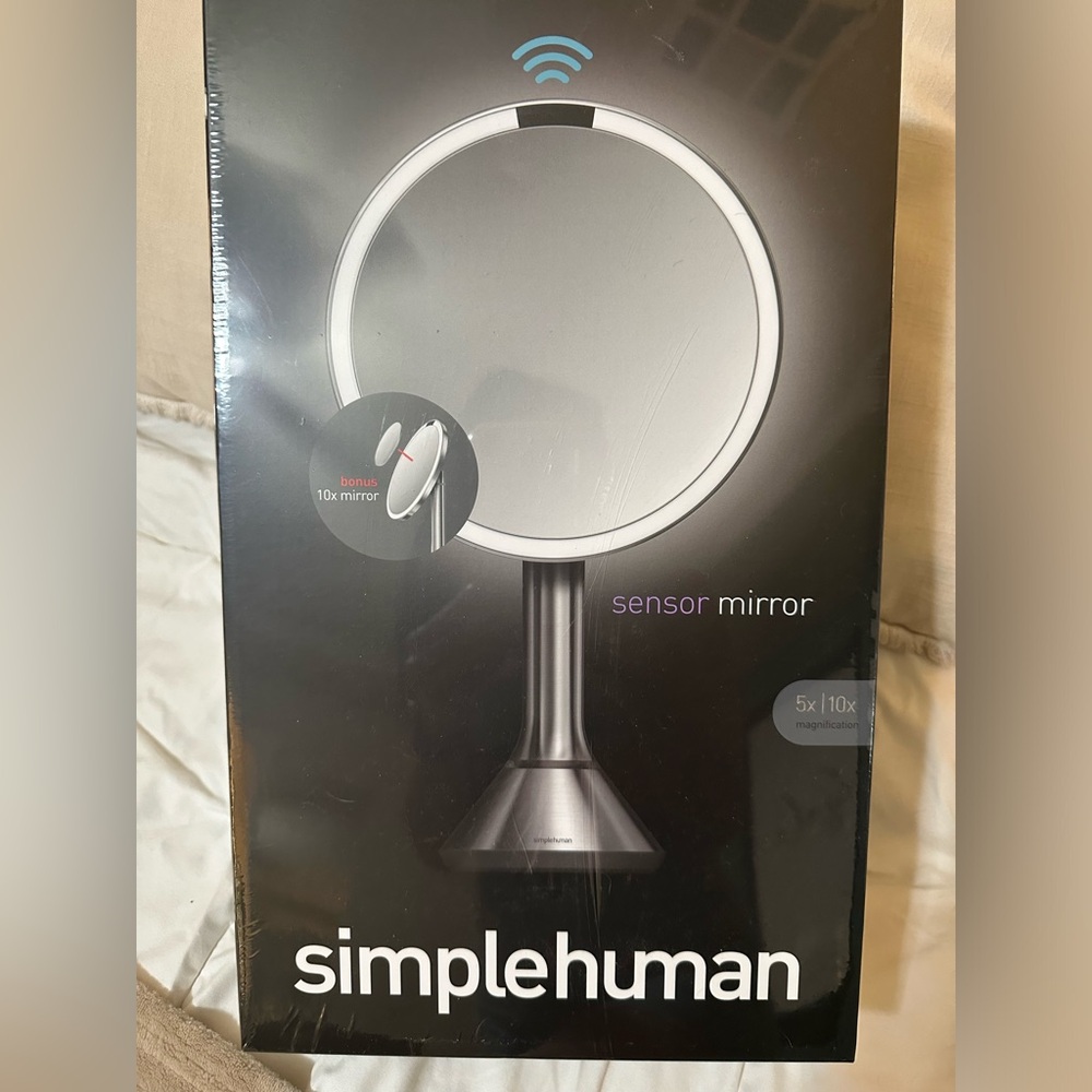 Brand new Simple Human sensor mirror. Never been opened.